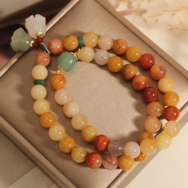 Women's natural jade multi-layer bracelet with orchid pendant detailing and jinsi construction