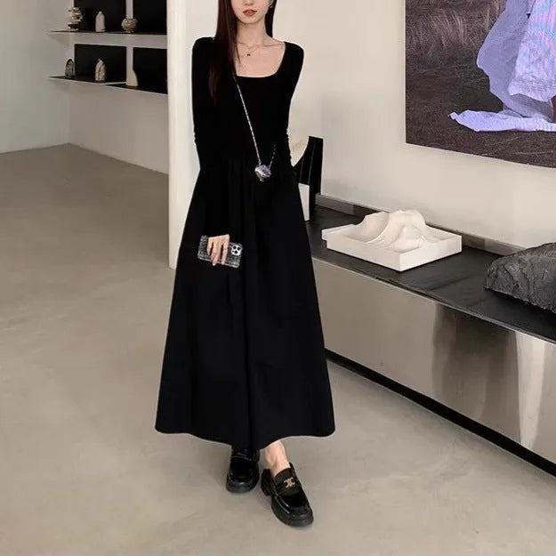 Women's black square collar knitted A-line dress with long sleeves and an elasticated waist.
