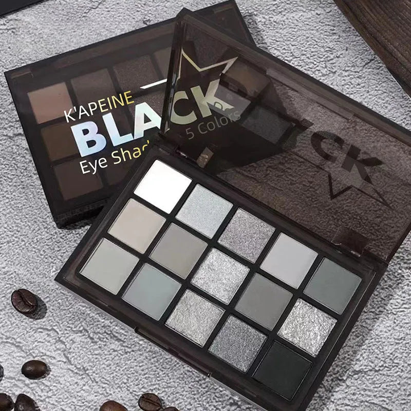 15-colour eyeshadow palette open showing matte and shimmer brown and blue eyeshadows.