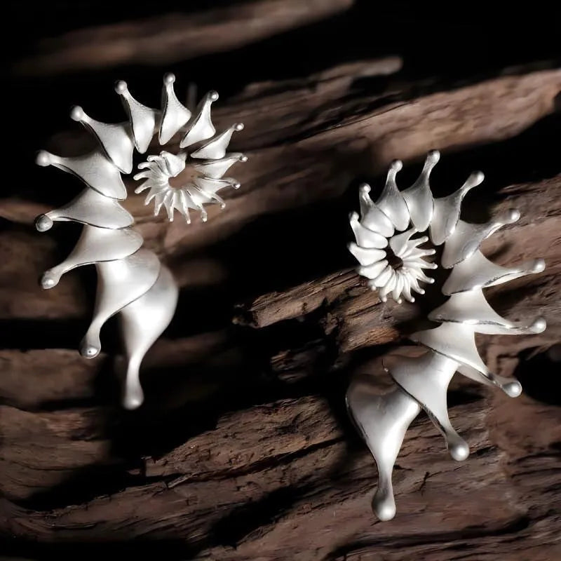 Exaggerated three-dimensional conch shell design matte earrings in alloy with electroplated finish