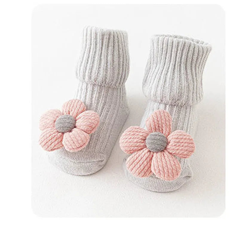 Cotton baby floor socks in blue bow pattern for infants 0-3 months.