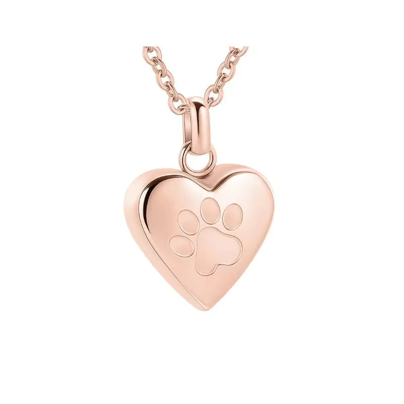 Silver heart-shaped titanium steel casket necklace with a paw print, shown open and closed.