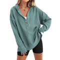 Women's loose fit raglan sleeve pullover sweater in a solid peacock green colour for autumn and winter.