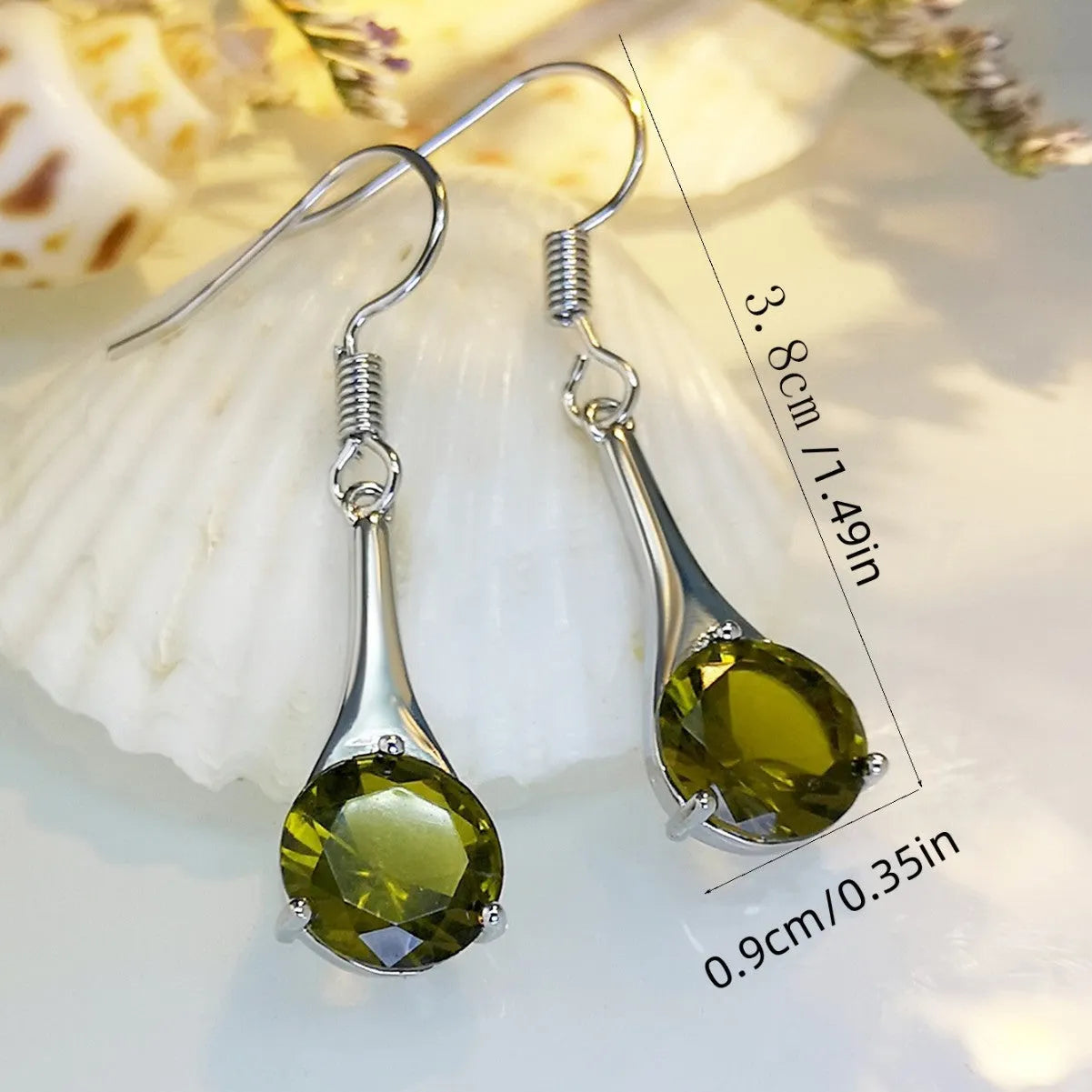 Women's olive green topaz coloured drop earrings with a simple water drop shape and retro style.