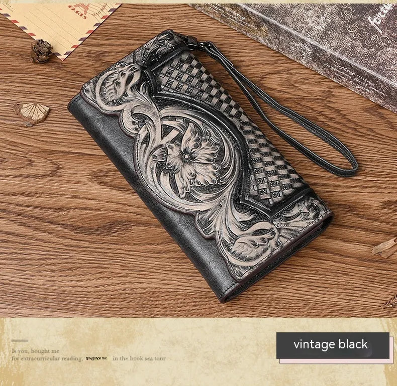 Women's brown tri-fold leather wallet with embossed floral pattern, shown open to reveal compartments.