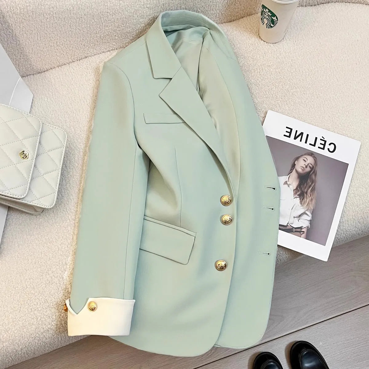 Women's Korean style loose fit mid-length polyester coat in milky white colour with long sleeves and pockets