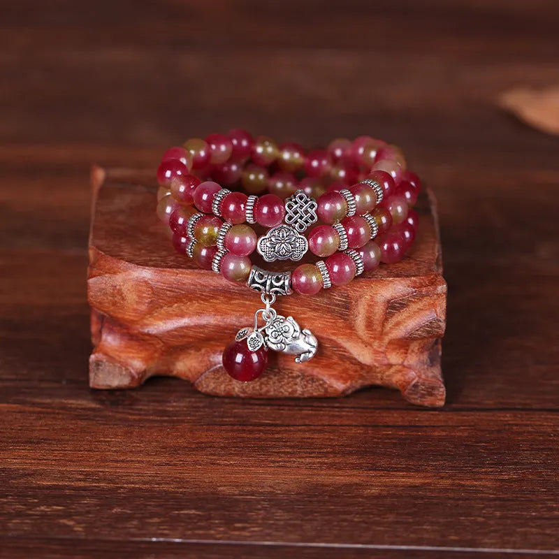 Natural watermelon crystal bracelet with Chinese knot design in 6mm and 8mm size options