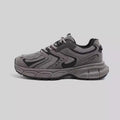 Grey platform dad shoes with PU mesh upper, leather stitching, and a chunky EVA sole.