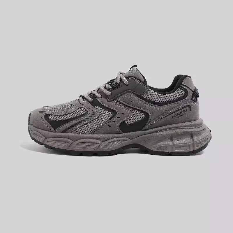 Grey platform dad shoes with PU mesh upper, leather stitching, and a chunky EVA sole.