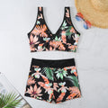 Women's two-piece swimsuit with printed boxer shorts in multi-colour pattern