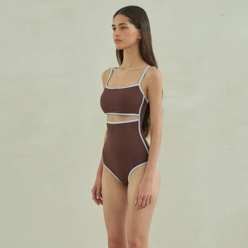 Brown triangle cut one-piece swimsuit for women on hanger showing front design