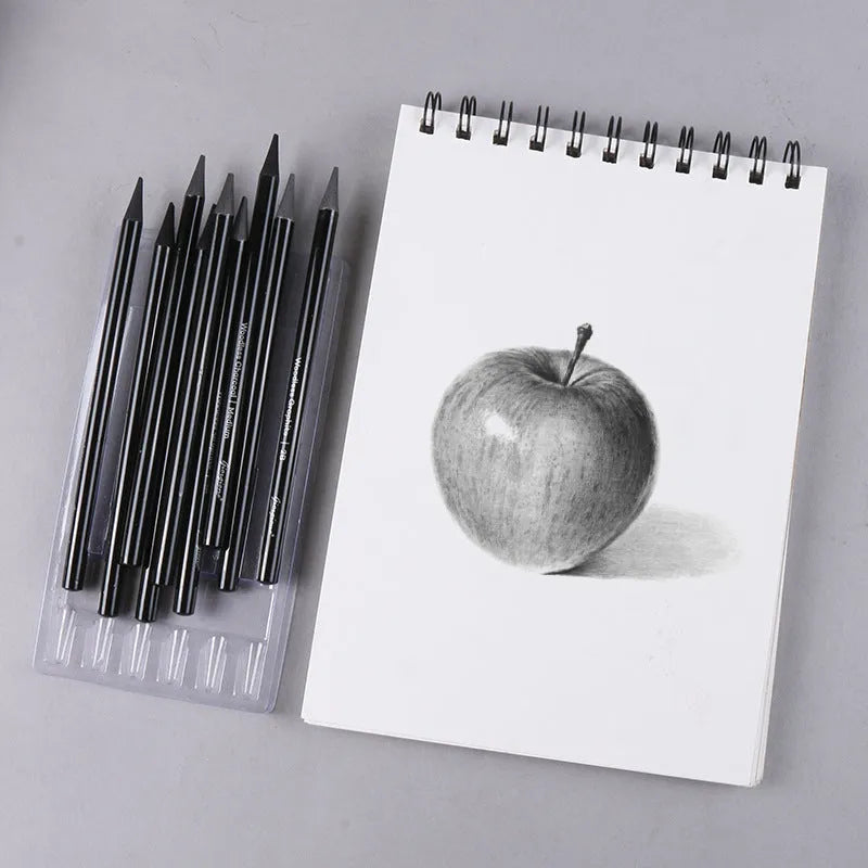 Set of nine art pencils on a card: six graphite pencils and three darker carbonized pencils in wooden casings.