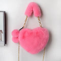 Soft plush heart-shaped women's handbag in a solid colour with a detachable shoulder strap.
