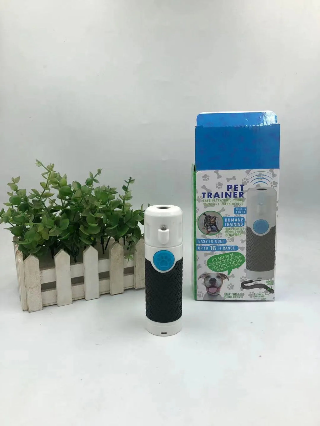 White ultrasonic dog trainer handheld device for bark control training