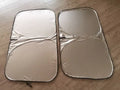Titanium silver aluminium foil car sunshade folded to show size and reflective surface