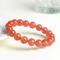Natural Cherry Red Agate bracelet with polished beads, shown in a single circle configuration.