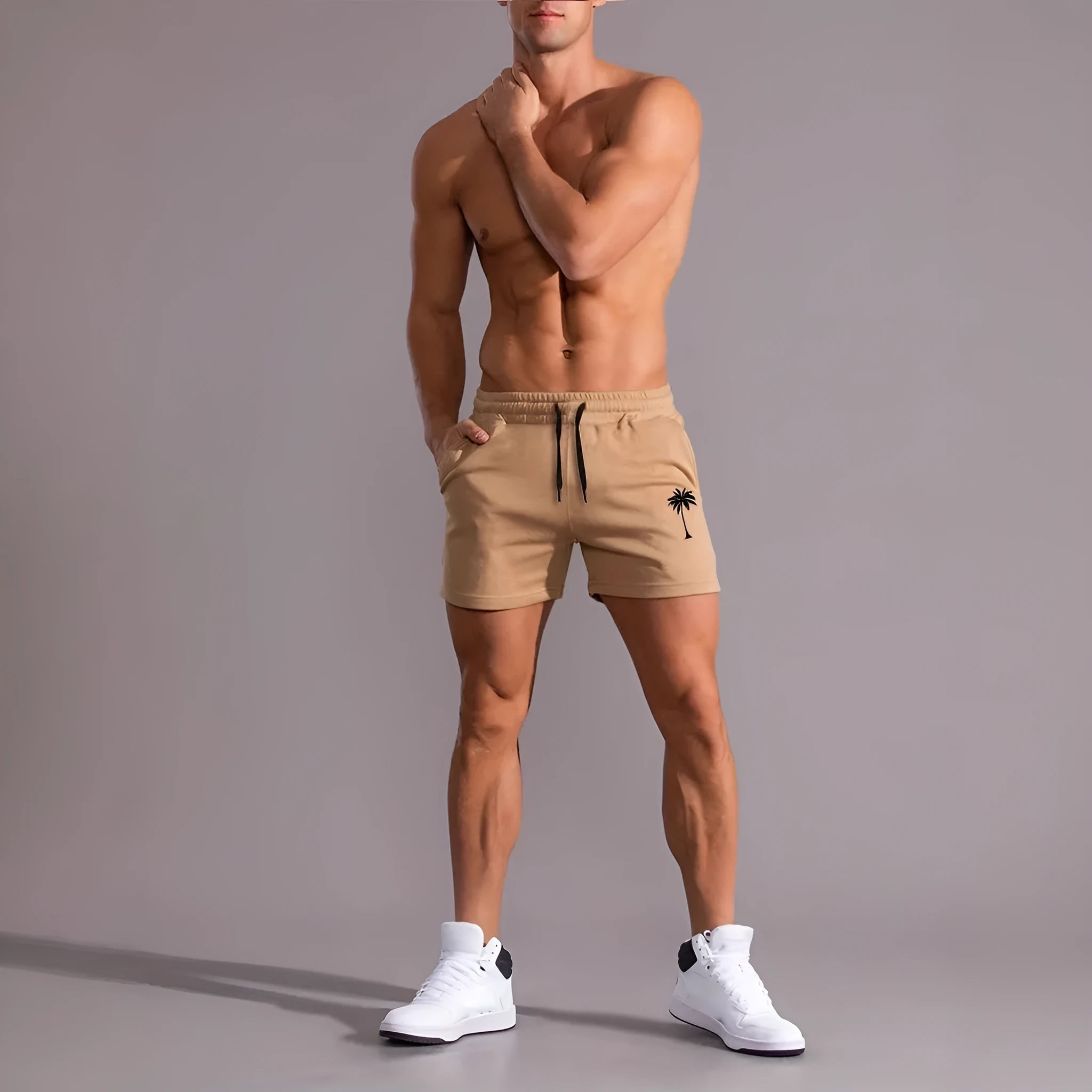 A pair of khaki men's casual shorts featuring a coconut print, shown in a straight-leg sports style.