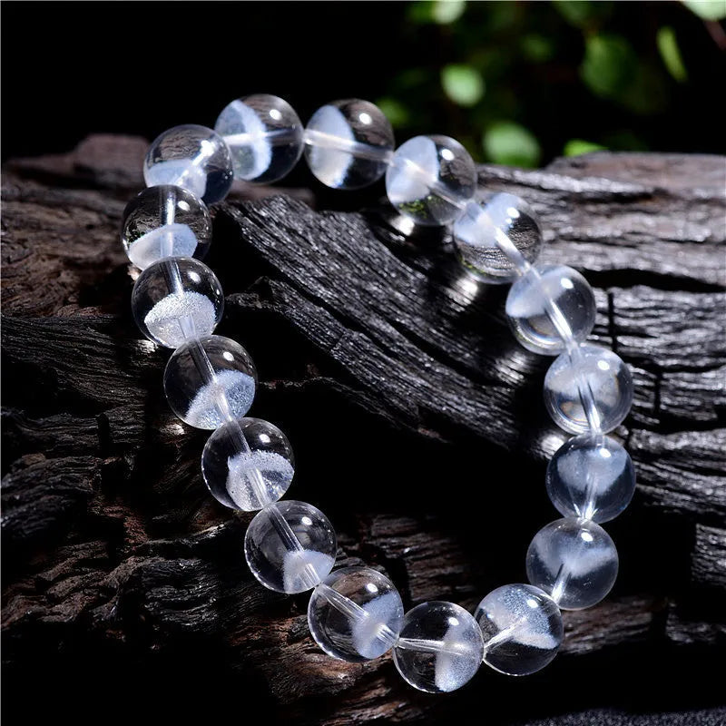 Women's white crystal bracelet with a pyramid charm and Ruyi symbol, showing different bead size options.