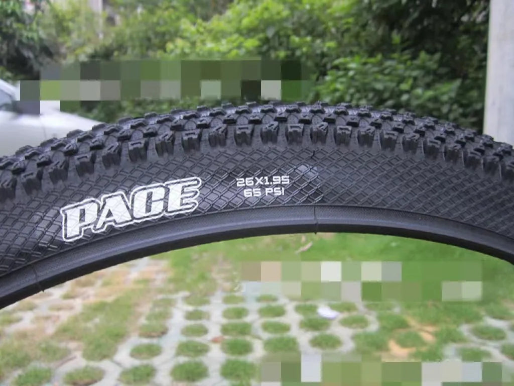 Ultralight mountain bike tyre with knobbly tread, shown in multiple size options including 26, 27.5 and 29 inch.