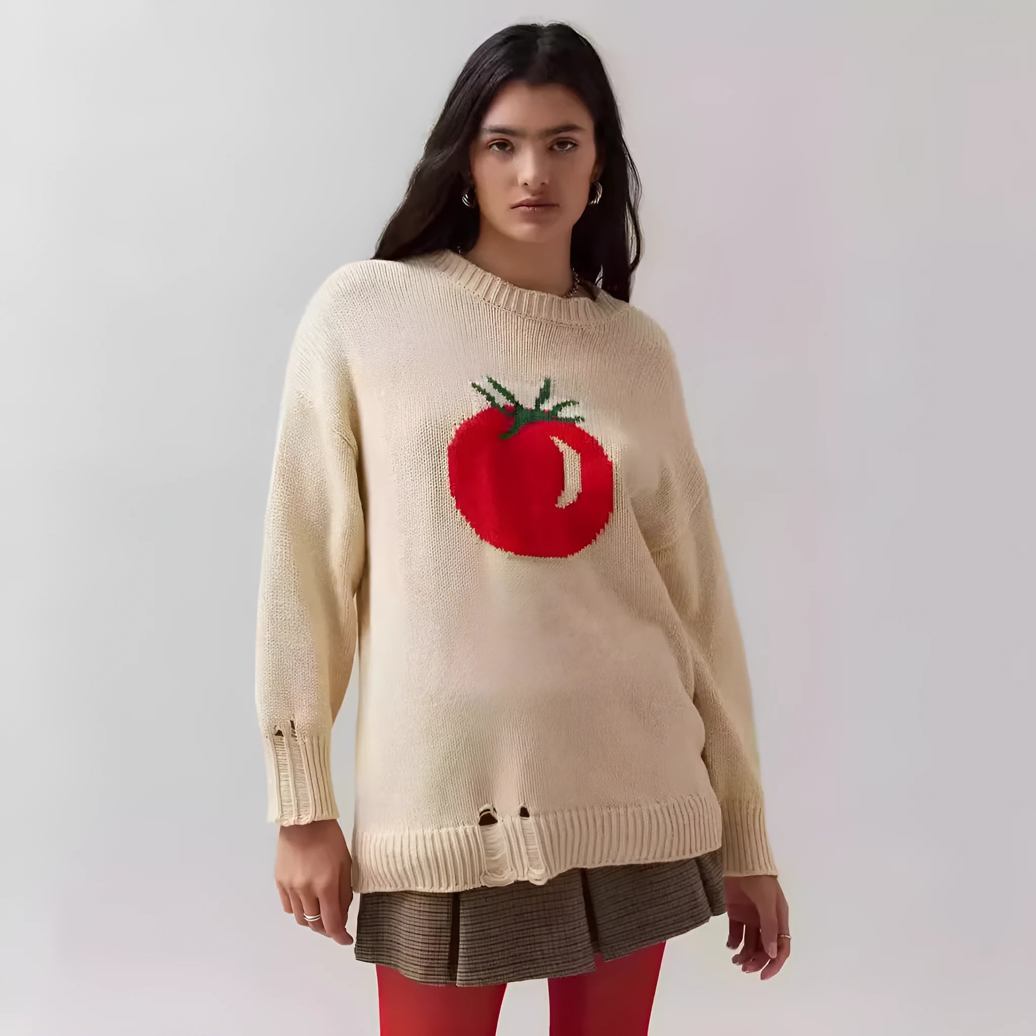 Women's loose-fitting round neck acrylic sweater with jacquard knit texture in a beige colour.