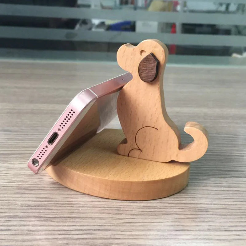 Beech wood and resin mobile phone holder with decorative animal design on desk