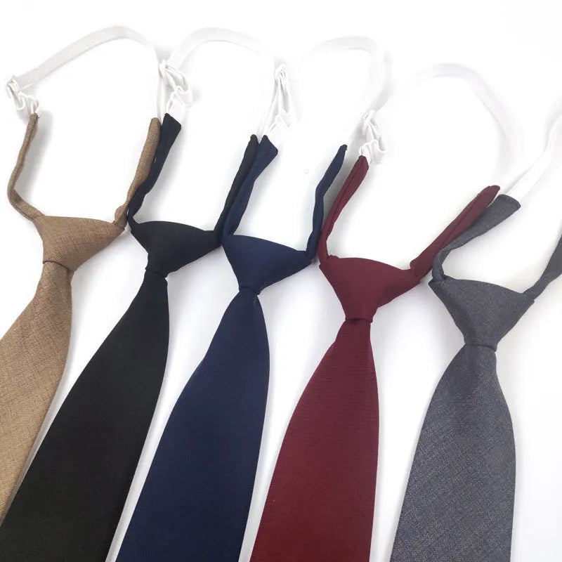 Men's solid colour cotton bow tie in arrow style, showing navy blue option.