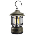 Dark green portable camping head lamp lantern with dimensions 16.6cm by 6.7cm by 9.6cm