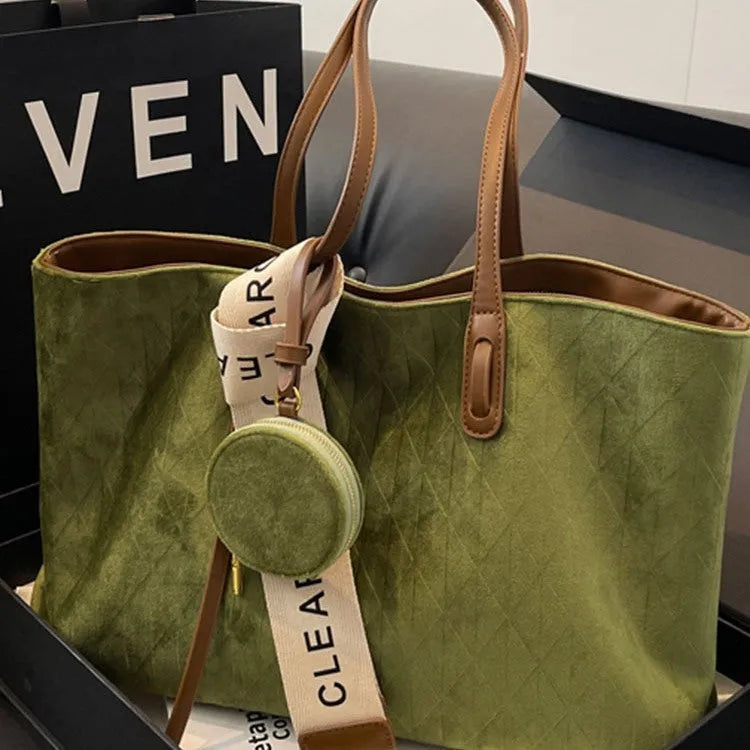 Soft large casual shoulder tote bag in a horizontal square shape with a sandwich pocket and sewing thread detail.