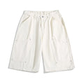 Casual wide-leg cropped workwear pants in apricot colour with elastic mid waist and rivet detailing