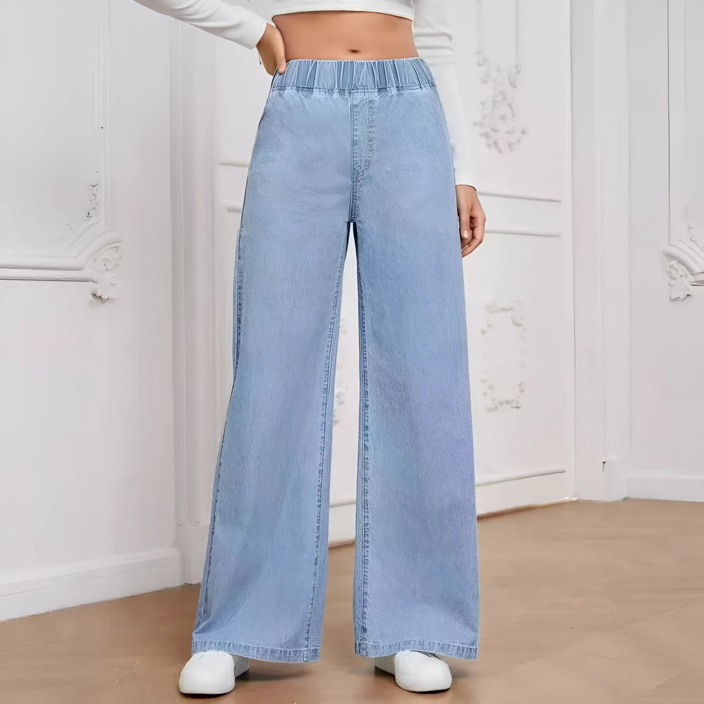 Plus size light blue washed straight leg jeans with wide fit and mid waist design
