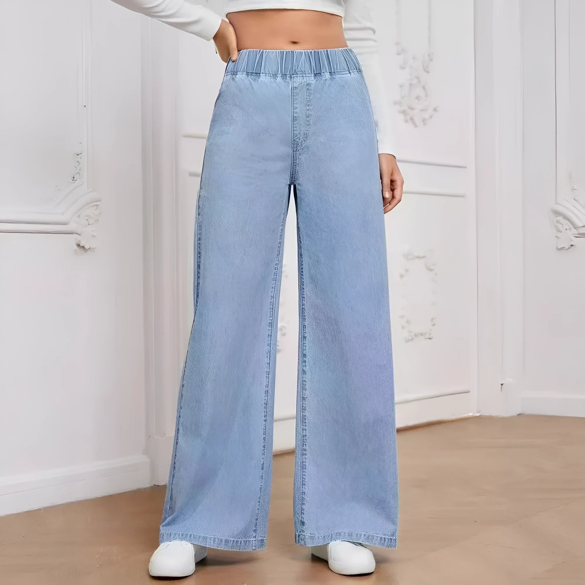 Plus size light blue washed straight leg jeans with wide fit and mid waist design