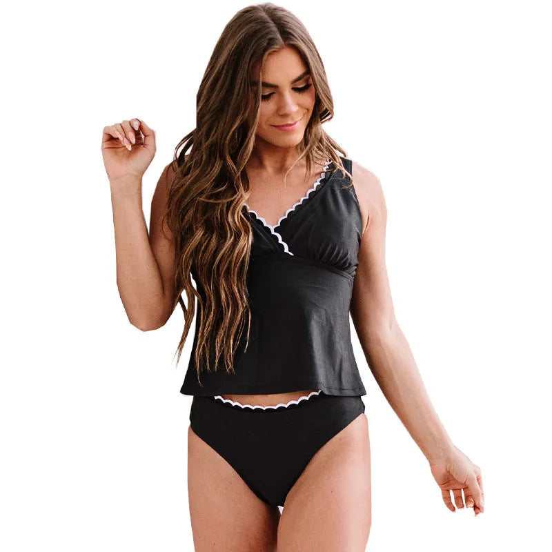 Black women's one-piece swimsuit with split leg design and sleeveless cut