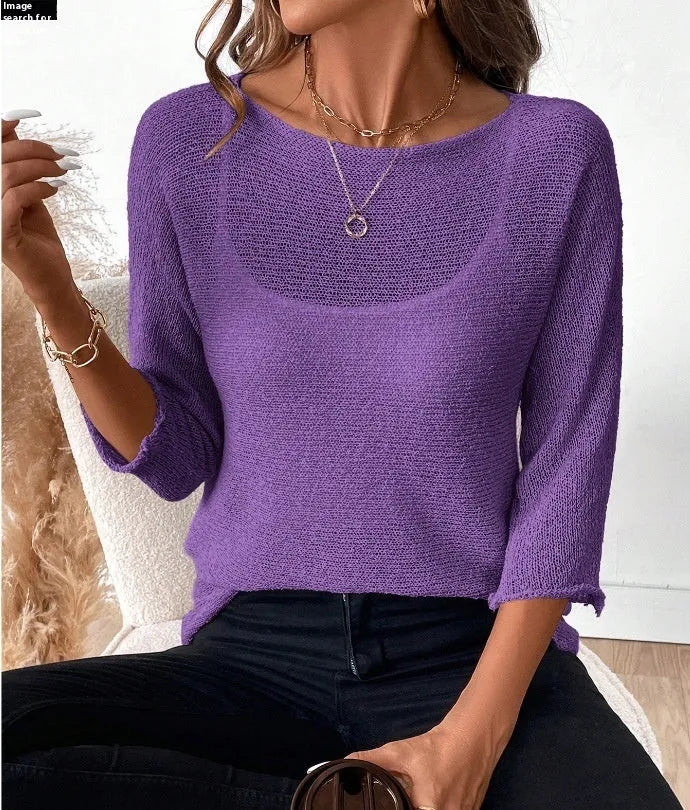 Woman wearing a thin knitted off-shoulder overall with a 3D pattern in a light colour.
