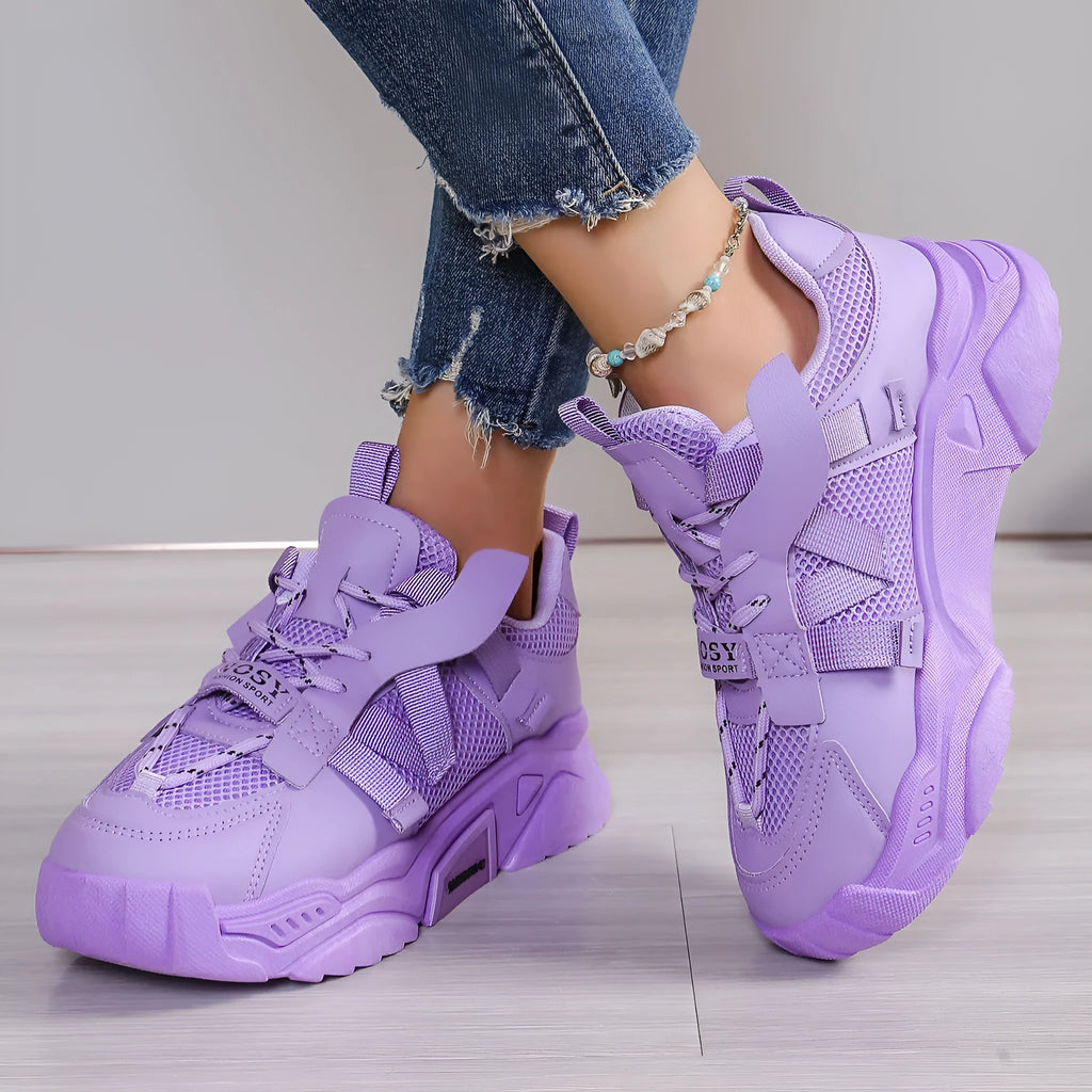 Women's purple platform mesh sports trainer with lace-up front on a white background.