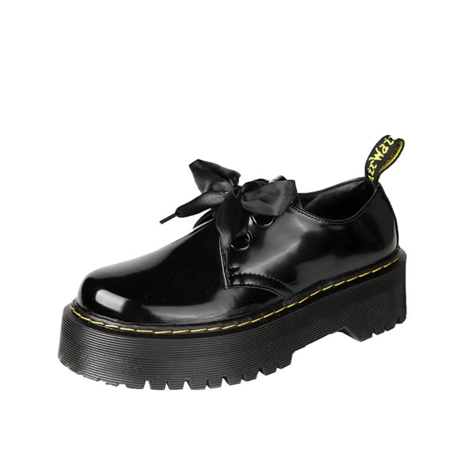 Black and white thick soled women's lace-up shoes with cross straps on a superfine fibre upper.