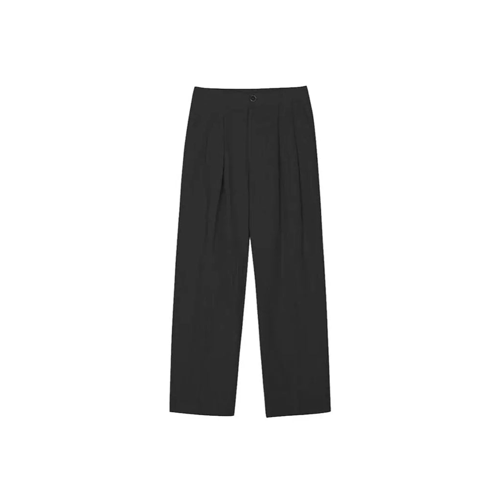 Men's apricot coloured loose-fit cotton linen trousers with a pencil leg and elastic waist on a neutral background.