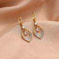 Gold electroplated copper zircon water drop tassel earrings in a teardrop shape