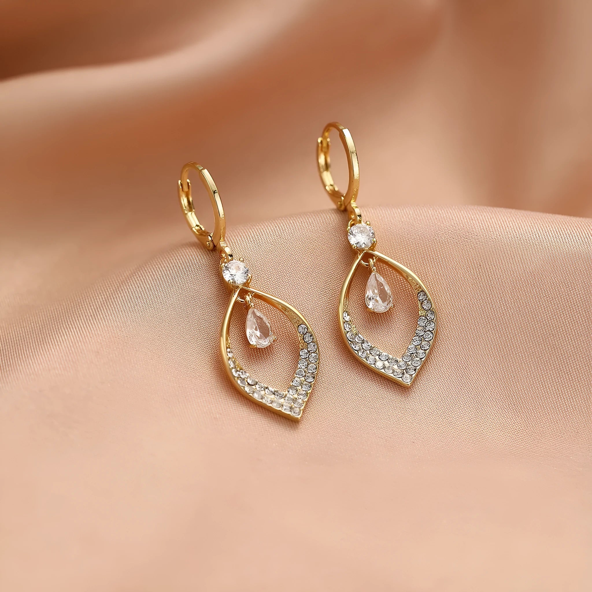 Gold electroplated copper zircon water drop tassel earrings in a teardrop shape