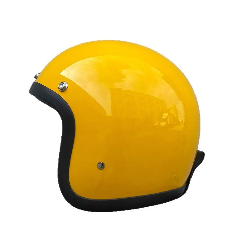 Cement grey retro half motorcycle helmet with glass fibre shell on a plain background.