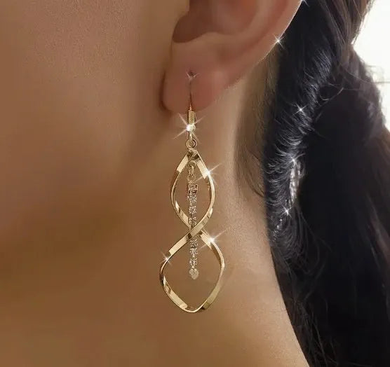 Geometric spiral design gold electroplated alloy earrings with elliptical shape