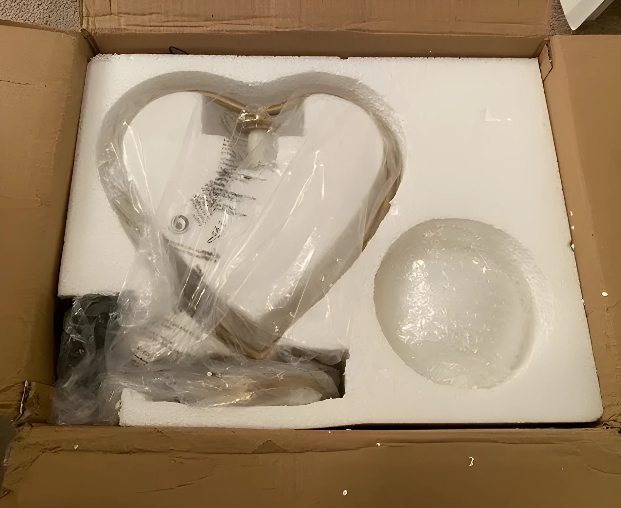 Pink heart shaped decorative LED lamp with multi-colour lights on a table