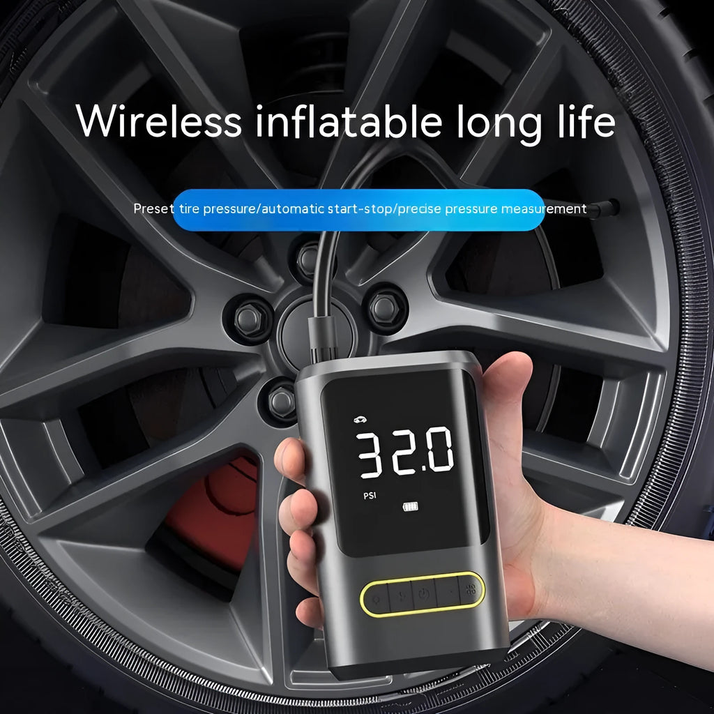 Black handheld digital wireless tyre inflator pump with LED light display on a grey background.