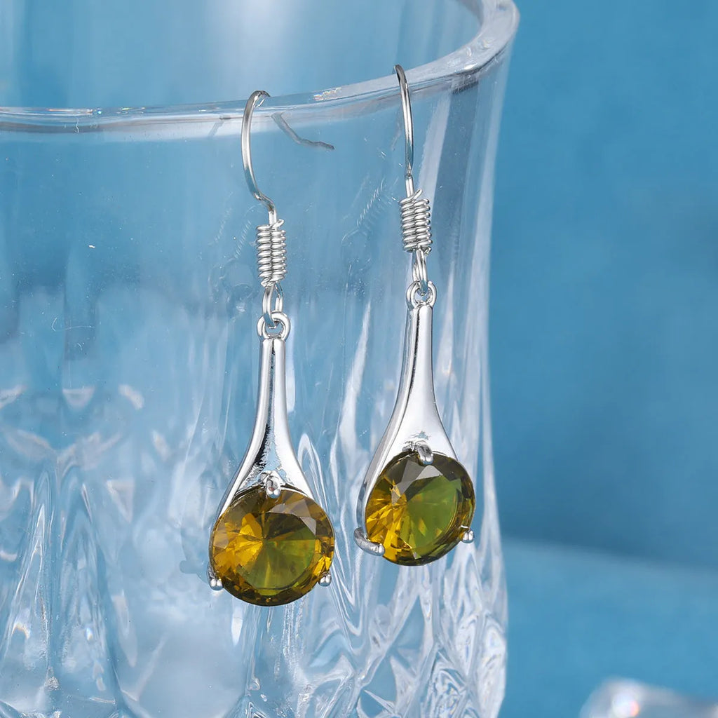 Women's olive green topaz coloured drop earrings with a simple water drop shape and retro style.