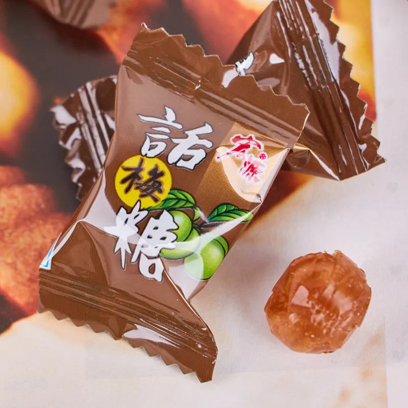 Bag of mixed hard candies in plum, guava, and tangerine peel flavours, total weight 1055g.