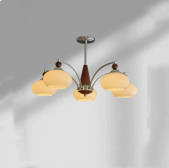 Middle Ancient style persimmon glass chandelier with chrome arms and milky white glass lampshades.