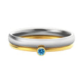 Close-up of a gold electroplated titanium steel ring with an engraved December birthstone geometric design.