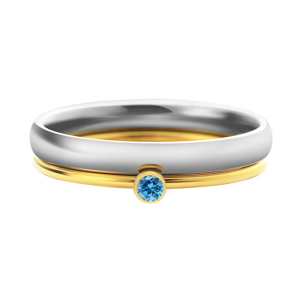 Close-up of a gold electroplated titanium steel ring with an engraved December birthstone geometric design.