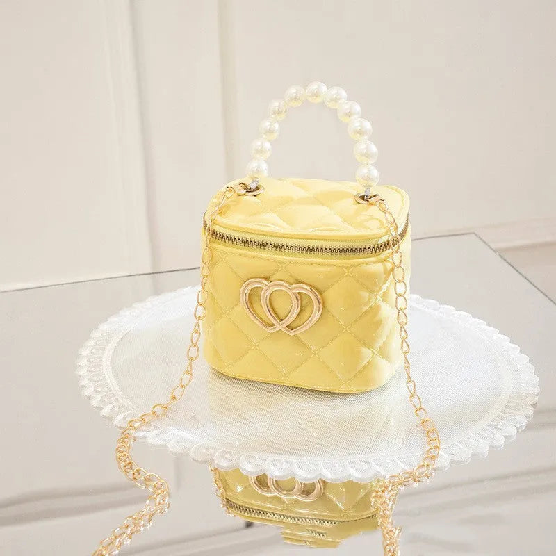 Women's PVC bucket shoulder bag with heart pattern in assorted colours