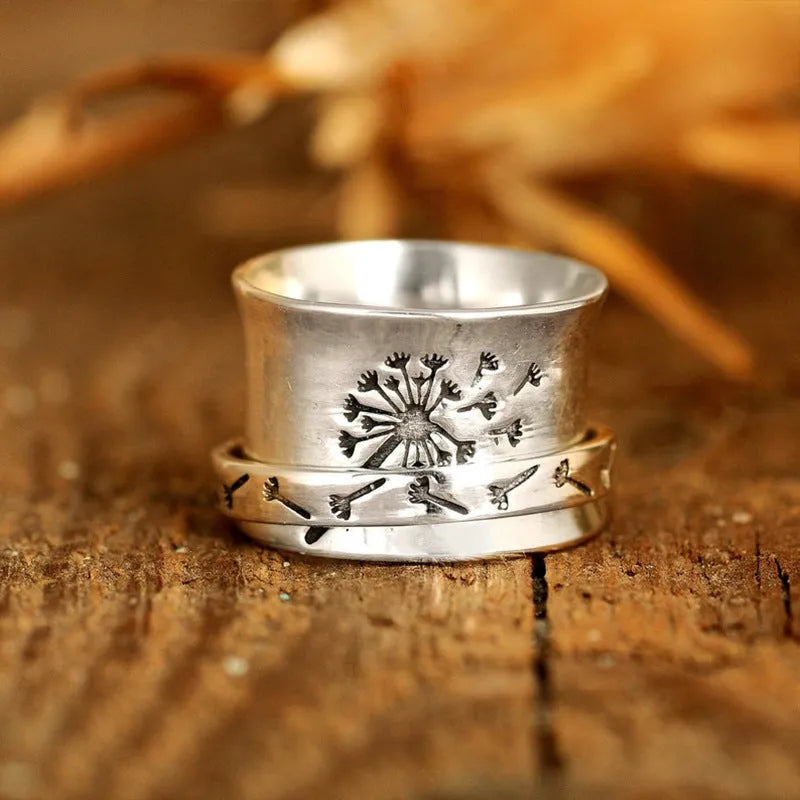 Adjustable silver flower ring with rotatable design fits five finger sizes