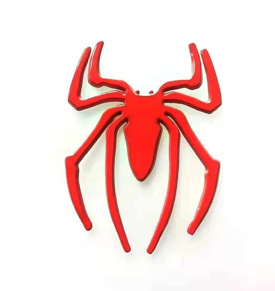 Three-dimensional metal spider bumper sticker in zinc alloy, showing gold, silver, black, and red colour options.